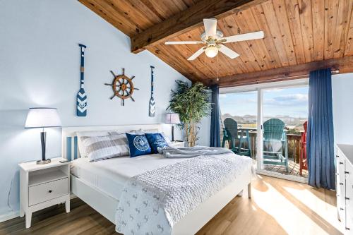 a bedroom with a bed and a ceiling fan at Carolina Coasting in Atlantic Beach