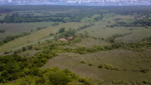 an aerial view of a house in a field at Hotel El Cocobolo Food&Rest Room 4 B&B WiFi AC Pkg Free Swimmingpool in Liberia