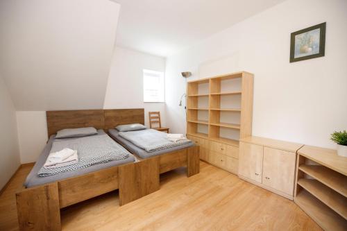 a bedroom with two beds in a room at Svycarska Bouda in Špindlerův Mlýn