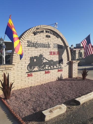 a brick wall with a sign that reads one mississippiippiippiippiippi at Stagecoach Suites in Wickenburg
