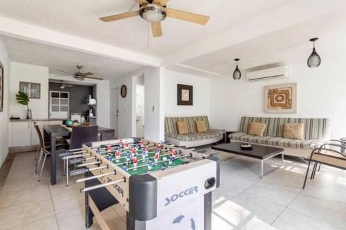 a living room with a foos ball on a table at Nuevo en Booking Casa Acapulco Diamante a Pasos de la Playa in Acapulco