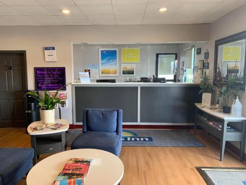a waiting room with a waiting counter in a clinic at Days Inn by Wyndham Louisville Airport Fair and Expo Center in Louisville