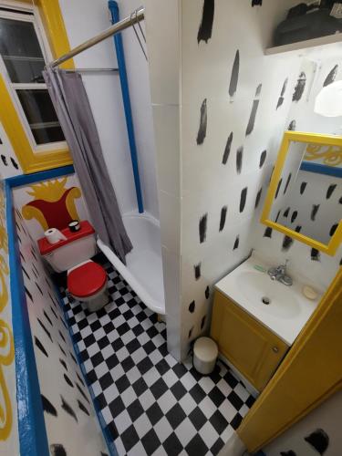 a toy bathroom with a sink and a toilet at comfortable private apartment near Manhattan on train in Woodside