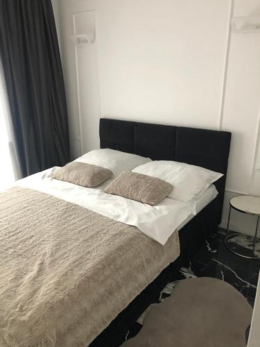 Ein Bett oder Betten in einem Zimmer der Unterkunft Apartment by Gustav