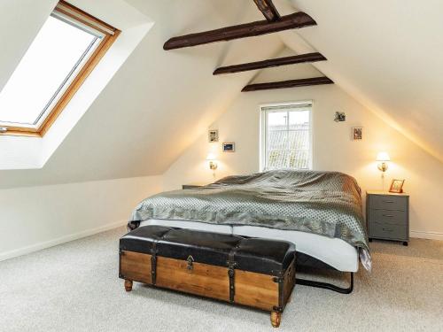 a bedroom with a bed and a large window at Charming Fisherman's Cottage - By Traum Ferienwohnungen in Borre