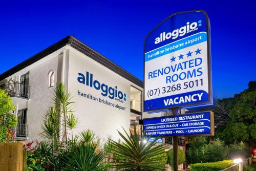 a sign in front of a building at Hamilton Brisbane Airport Hotel in Brisbane