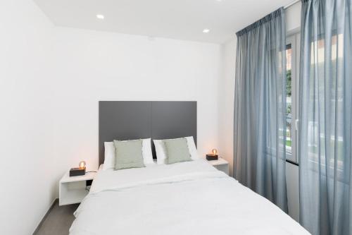 Ένα ή περισσότερα κρεβάτια σε δωμάτιο στο Villa la Matta Apartments and Luxury suites