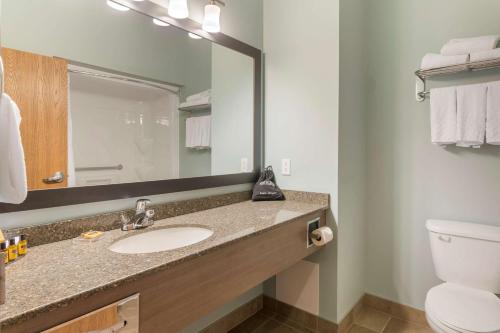 a bathroom with a sink and a toilet and a mirror at Best Western Plus Liverpool Hotel & Conference Centre in Liverpool