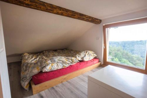 a bedroom with a bed and a large window at Holiday home in Sentvid pri Sticni - Zentralslowenien 43927 in Šentvid pri Stični