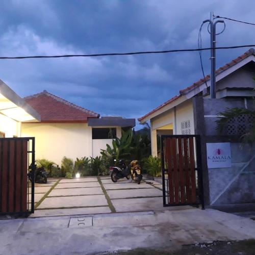 a motorcycle parked in front of a house at kamala in Selong Belanak