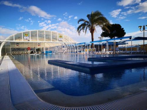 a pool of water in front of a building at Casa Hermosa in Fortuna