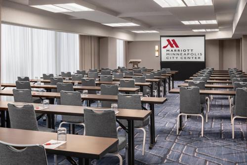 a classroom with tables and chairs in a room at Minneapolis Marriott City Center in Minneapolis