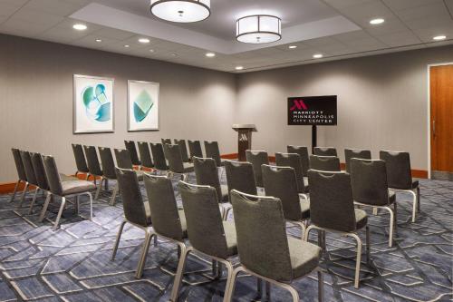a conference room with chairs and a podium at Minneapolis Marriott City Center in Minneapolis
