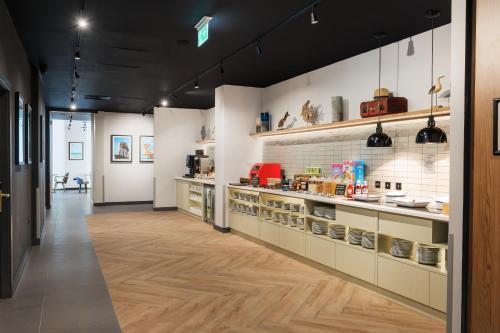 a room with a counter with food on it at Staybridge Suites Brighton, an IHG Hotel in Brighton & Hove