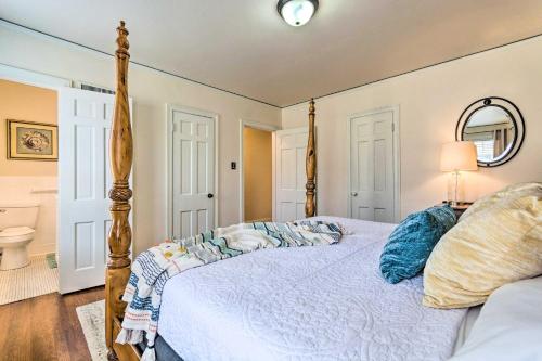 a bedroom with a bed with a wooden frame at Little Rock Home about 5 Mi to Downtown! in Little Rock