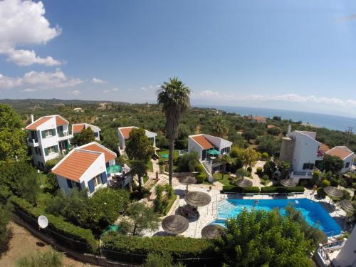 an aerial view of a villa with a swimming pool at Paris Village Apartments in Chrani