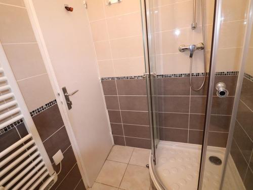 a bathroom with a shower with a glass door at Appartement Le Grau-du-Roi, 2 pièces, 6 personnes - FR-1-307-8 in Le Grau-du-Roi