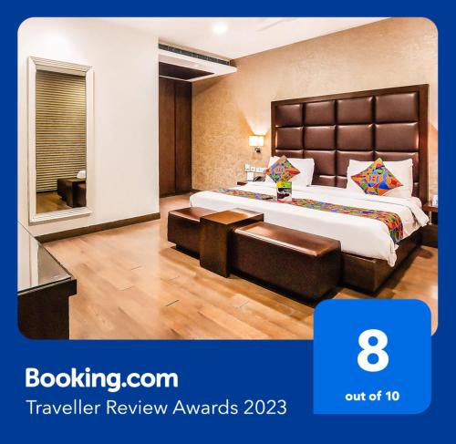 a hotel room with a bed and a window at Jasmine Boutique Hotel Jasola in New Delhi