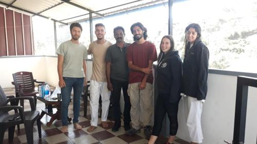 a group of people posing for a picture at CARMEL HOME STAY in Munnar