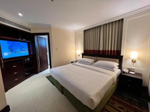 Letto o letti in una camera di City Seasons Suites