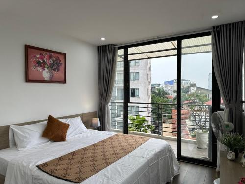 מיטה או מיטות בחדר ב-Luxe Paradise Residence 19 To Ngoc Van