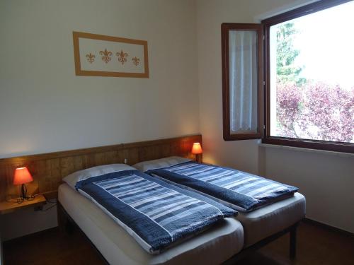 Ένα ή περισσότερα κρεβάτια σε δωμάτιο στο Villa Soghetta Typ S4