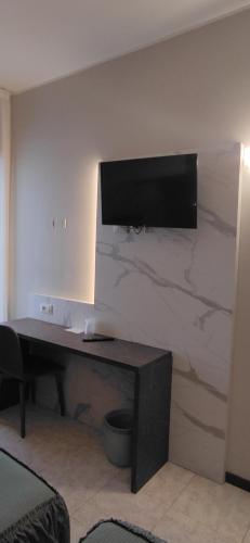 Телевизор и/или развлекательный центр в Hotel Mistral
