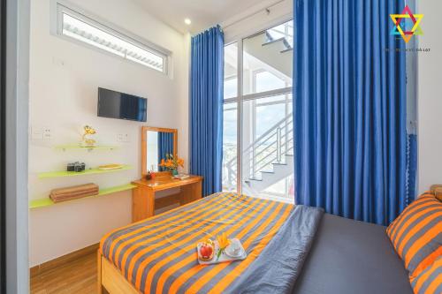 Ένα ή περισσότερα κρεβάτια σε δωμάτιο στο Villa Tuan Vu Da Lat