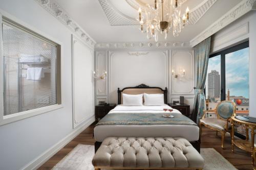 Ένα ή περισσότερα κρεβάτια σε δωμάτιο στο The Time Hotel Marina