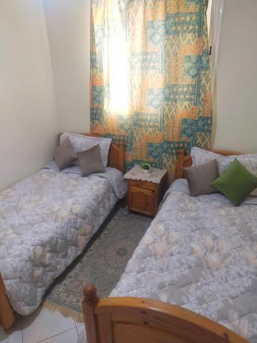 Ліжко або ліжка в номері Appartement à louer à Tadamon 2 Hay Salam / Agadir