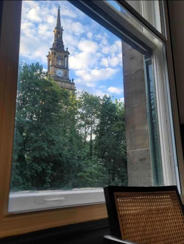 a view of a clock tower from a window at Luxury Apartment in the heart of Newcastle centre in Newcastle upon Tyne