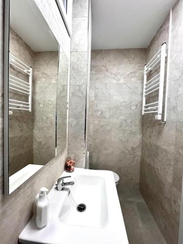 a bathroom with a sink and a mirror at Cool Space in Madrid