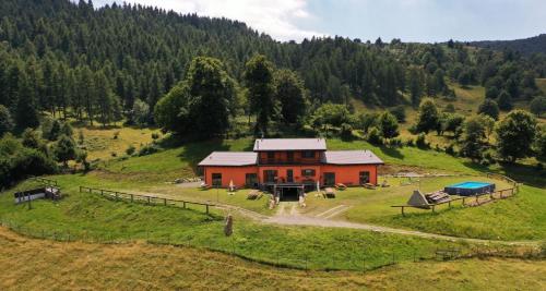 an aerial view of a house on a hill at Agriturismo Baita Bavè in San Fedele Superiore