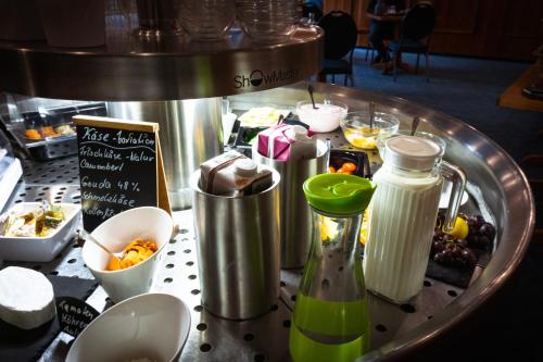 a table topped with a counter with food and drinks at Berghotel Steiger - Erzgebirge in Schneeberg