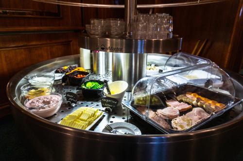 a food cart with food on top of it at Berghotel Steiger - Erzgebirge in Schneeberg