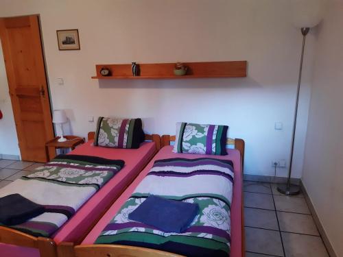 two twin beds in a room with at Penzion Montana in Nýrsko