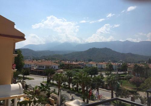 a view of a city with mountains in the background at STELLA HOTEL&Spa ALL INCLUSIVE in Kemer