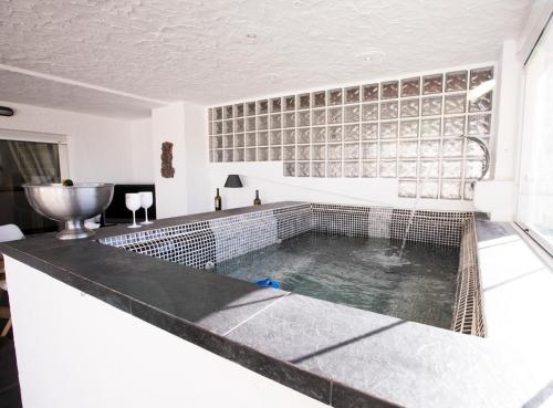 a swimming pool in the middle of a room at Chalet asosado in Almerimar