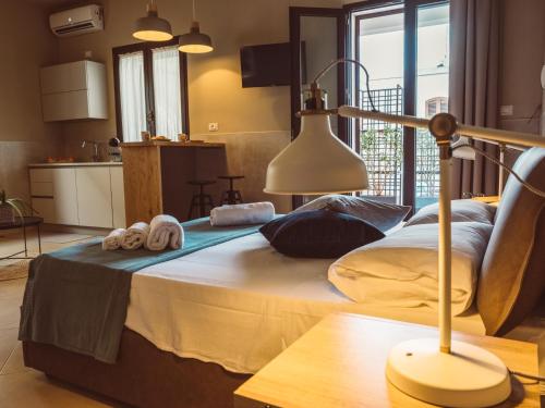 a bedroom with a large bed with towels on it at B&B Casa di Gio' in Tiggiano