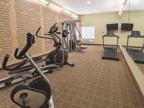 a gym with treadmills and elliptical machines at La Quinta by Wyndham Waxahachie in Waxahachie