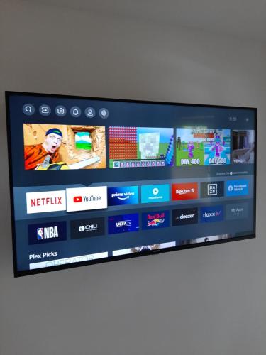 TV a/nebo společenská místnost v ubytování Loftwohnung mit Bergblick
