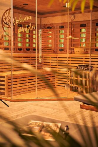 a blurry picture of a room with wooden benches at Chalets Franciska Major, Pro Village in Sopronkövesd