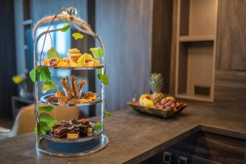 a tower of food on top of a counter at Hotel Pia Bella in Kérynia