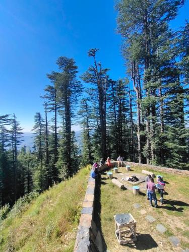 a group of people standing on top of a hill at Norvin Homes in Shimla