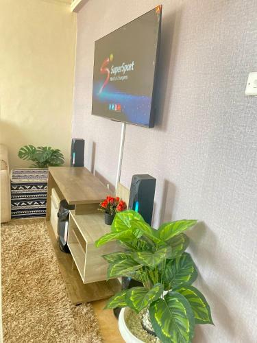 TV a/nebo společenská místnost v ubytování Cream Loft