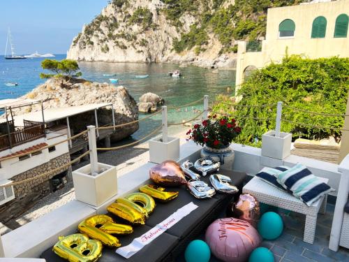 a table with eggs and bananas on top of a boat at Capri Suite on the beach in Capri