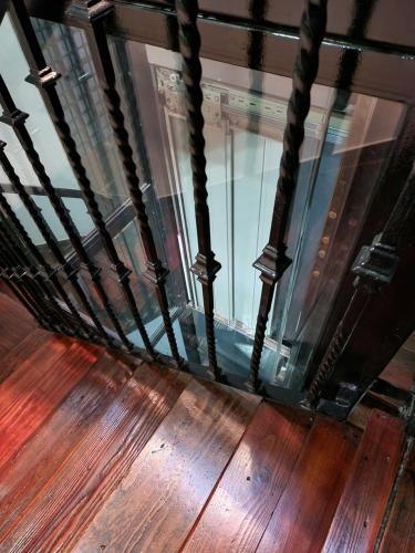 a view from the top of a wooden floor with a window at 1930 Diecinueve Treinta "Diseño, historia y confort en el centro de Gijón" in Gijón