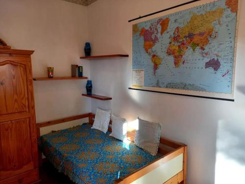 a room with a bed with a map on the wall at CASA LOLA in Livorno