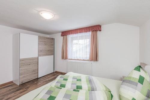 Ένα ή περισσότερα κρεβάτια σε δωμάτιο στο Ferienhaus Oberried