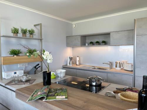 a kitchen with a sink and a counter at Villa Am Meer Glowe Apartment EG in Glowe